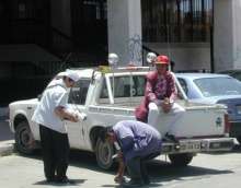 Downtown parking attendant (purple vest)